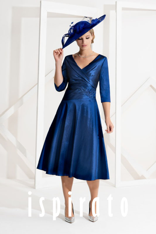 Photo of a lady wearing a blue dress.